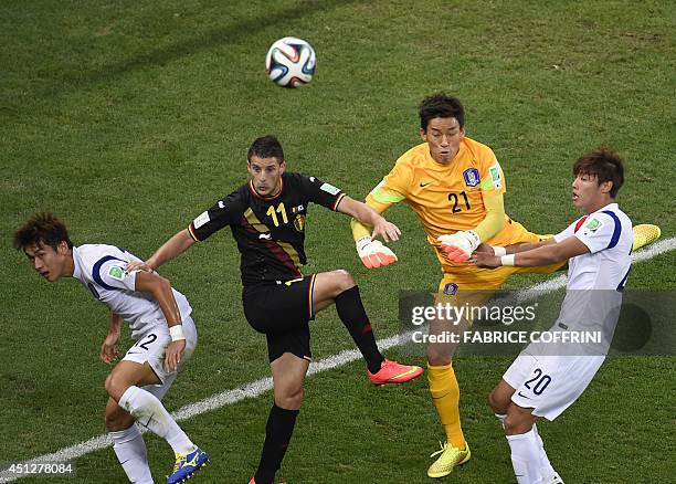 Belgium's goalkeeper Simon Mignolet vies with South Korea's defender Lee Yong, South Korea's goalkeeper Kim Seung-Gyu and South Korea's defender Hong...