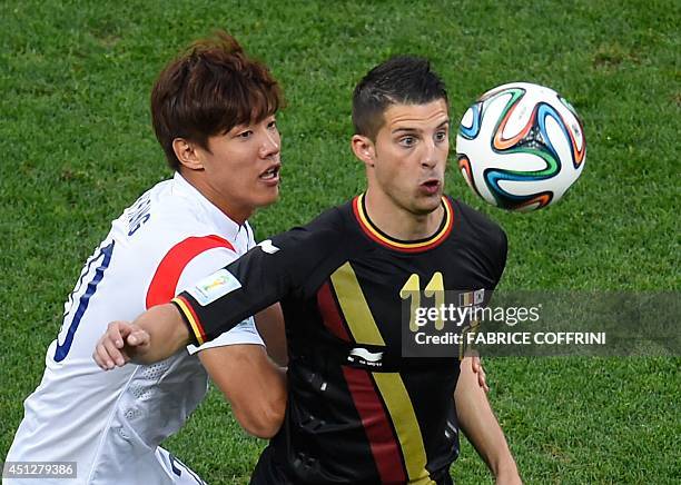 South Korea's defender Hong Jeong-Ho vies with Belgium's forward Kevin Mirallas during a Group H football match between South Korea and Belgium at...