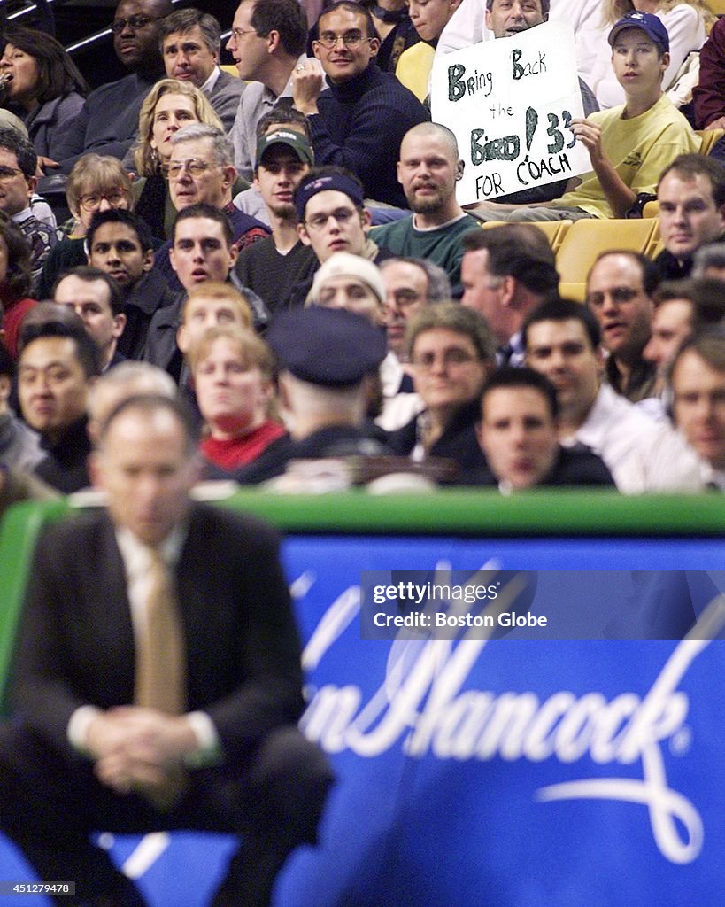 Fans Hold Signs At Celtics Game