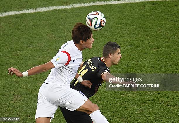 South Korea's defender Hong Jeong-Ho vies with Belgium's forward Kevin Mirallas during a Group H football match between South Korea and Belgium at...
