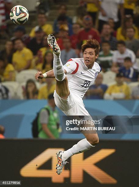 South Korea's defender Hong Jeong-Ho kicks the ball during a Group H football match between South Korea and Belgium at the Corinthians Arena in Sao...