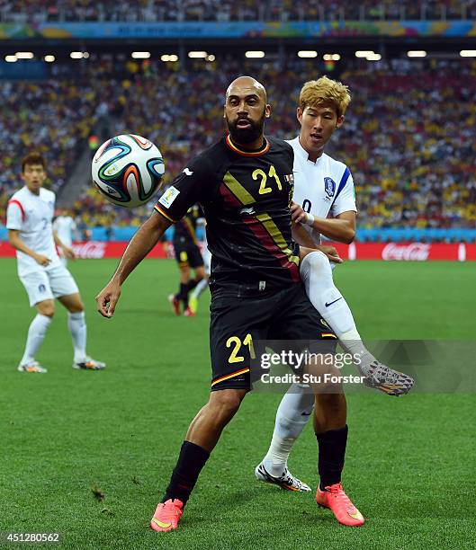 Anthony Vanden Borre of Belgium and Son Heung-Min of South Korea compete for the ball during the 2014 FIFA World Cup Brazil Group H match between...