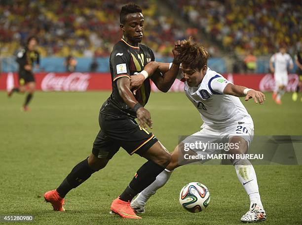 Belgium's forward Divock Origi vies with South Korea's defender Hong Jeong-Ho during a Group H football match between South Korea and Belgium at the...
