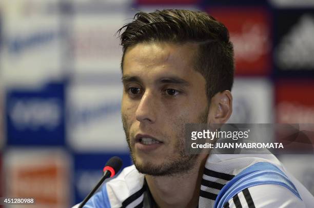 Argentina's midfielder Ricky Alvarez talks to journalists during a press conference at "Cidade do Galo", the base camp in Vespasiano, near Belo...