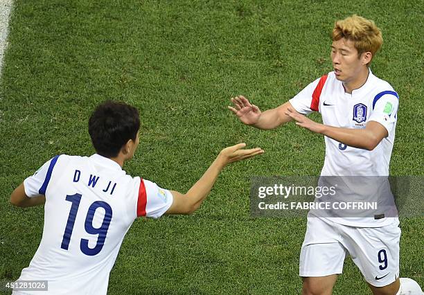 South Korea's midfielder Son Heung-Min is substituted by South Korea's defender Hong Jeong-Ho during a Group H football match between South Korea and...