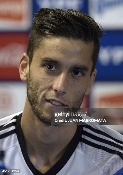 Argentina's midfielder Ricky Alvarez gestures during a press conference at "Cidade do Galo", the base camp in Vespasiano, near Belo Horizonte, on...