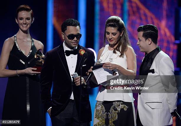 Presenters Toby Love, Mayrin Villanueva and Fito Blanko speak onstage during The 14th Annual Latin GRAMMY Awards at the Mandalay Bay Events Center on...