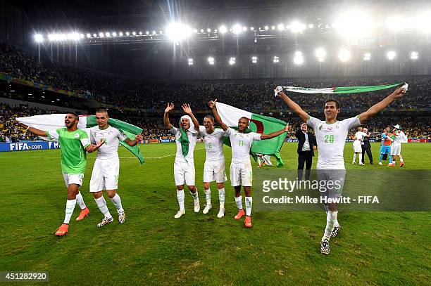 Aissa Mandi of and players of Algeria celebrate qualifying for the knock out stage after the 1-1 draw in the 2014 FIFA World Cup Brazil Group H match...