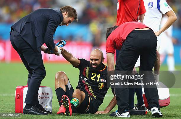 Anthony Vanden Borre of Belgium lies injured during the 2014 FIFA World Cup Brazil Group H match between Korea Republic and Belgium at Arena de Sao...