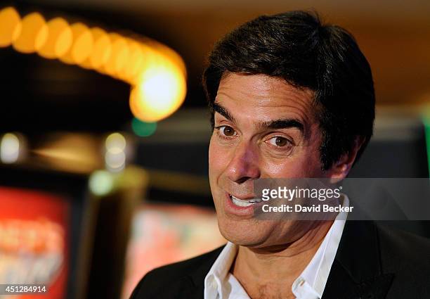 Magician David Copperfield speaks before the unveiling of a new slot machine, "The Magic of David Copperfield," by Bally Technologies at the MGM...