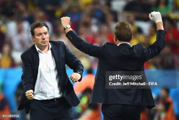 Head coach Marc Wilmots of Belgium celebrates the 1-0 win with a team staff after the 2014 FIFA World Cup Brazil Group H match between Korea Republic...