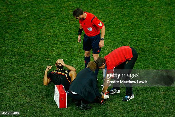 Anthony Vanden Borre of Belgium receives treatment during the 2014 FIFA World Cup Brazil Group H match between South Korea and Belgium at Arena de...