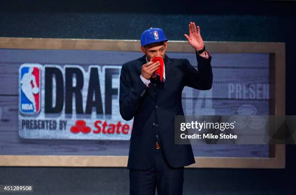 Isaiah Austin of Baylor is honored on stage during the 2014 NBA Draft at Barclays Center on June 26, 2014 in the Brooklyn borough of New York City....