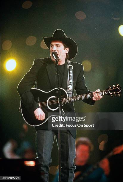 Clint Black preforms during the halftime show of Super Bowl XXVIII between the Dallas Cowboys and Buffalo Bills on January 30, 1994 at the Georgia...