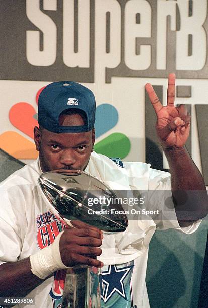 Running back Emmitt Smith of the Dallas Cowboys kisses the Vince Lombardi Trophy after the Cowboys defeated the Buffalo Bills 30-13 in Super Bowl...