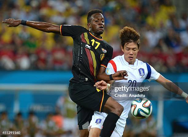 Belgium's Divock Origi vies for the ball with SouthKorea's Hong Jeongho during the 2014 FIFA World Cup group H soccer match between South Korea and...