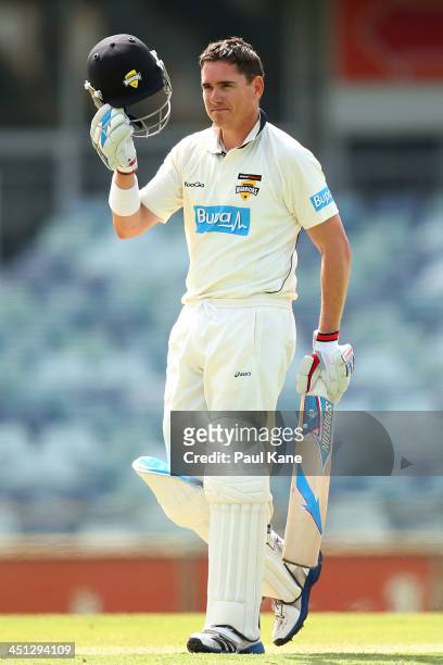 Marcus North of the Warriors celebrates his century during day one of the Sheffield Shield match between the Western Australia Warriors and the...