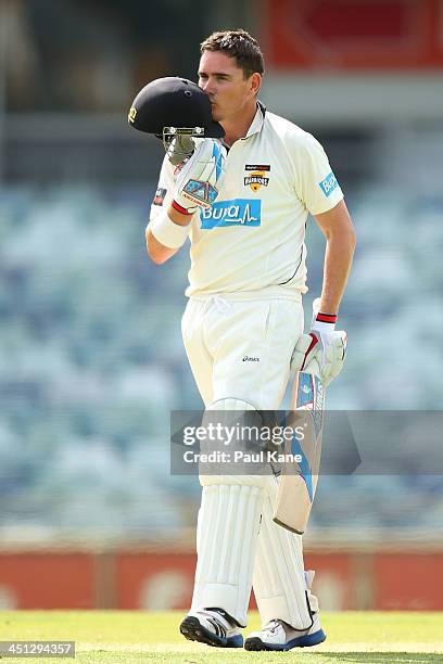 Marcus North of the Warriors celebrates his century during day one of the Sheffield Shield match between the Western Australia Warriors and the...