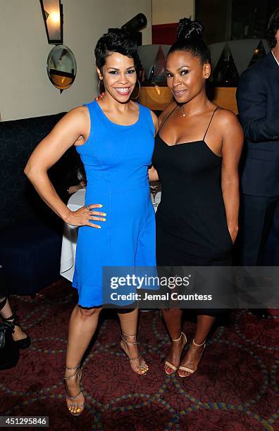 Journalist April Woodard and actress Nia Long attend "The Divide" series premiere after party at Circo on June 26, 2014 in New York City.