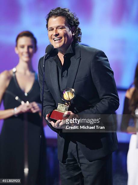 Carlos Vives accepts the Best Tropical Fusion Album GRAMMY Award for 'Corazn Profundo' onstage during the 14th Annual Latin GRAMMY Awards held at...