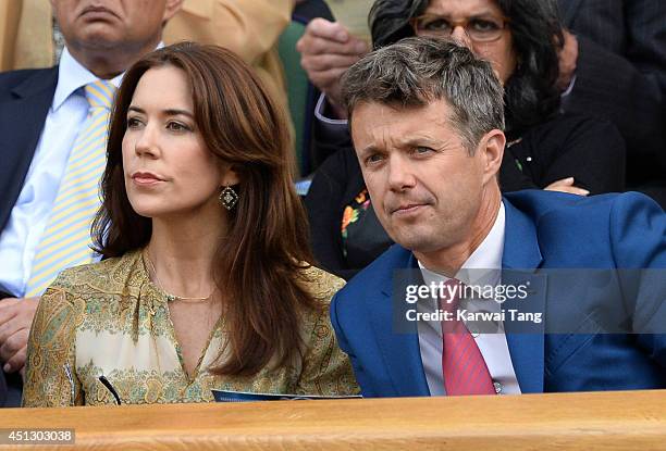 Crown Princess Mary of Denmark and Frederik, Crown Prince of Denmark attend the Gilles Muller v Roger Federer match on centre court during day four...
