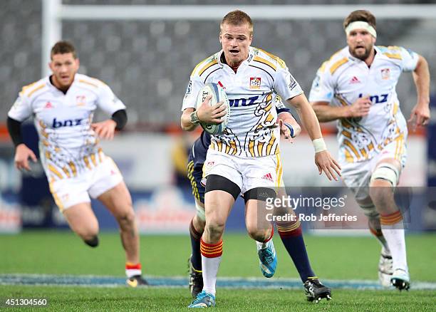 Gareth Anscombe of Chiefs on the attack during the round 17 Super Rugby match between the Highlanders and the Chiefs at Forsyth Barr Stadium on June...