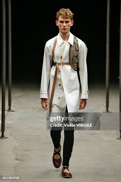 Model walks the runway during the Dries Van Noten show as part of Paris Fashion Week Menswear Spring/Summer 2015 on June 26, 2014 in Paris, France.