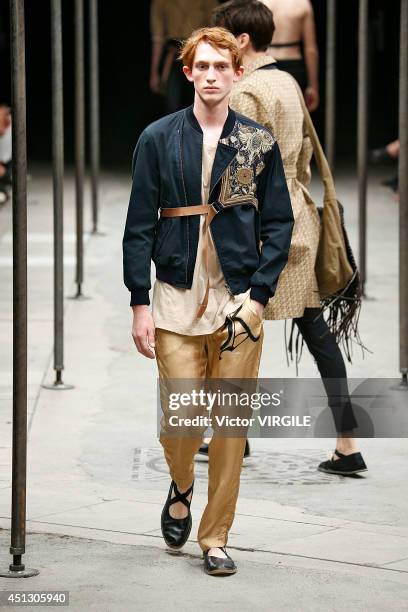 Model walks the runway during the Dries Van Noten show as part of Paris Fashion Week Menswear Spring/Summer 2015 on June 26, 2014 in Paris, France.