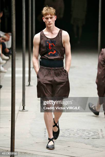 Model walks the runway during the Dries Van Noten show as part of Paris Fashion Week Menswear Spring/Summer 2015 on June 26, 2014 in Paris, France.