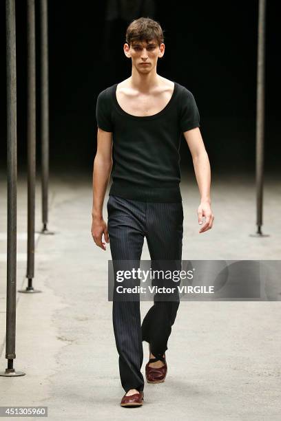 Model walks the runway during the Dries Van Noten show as part of Paris Fashion Week Menswear Spring/Summer 2015 on June 26, 2014 in Paris, France.