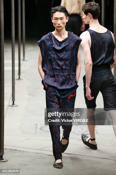 Model walks the runway during the Dries Van Noten show as part of Paris Fashion Week Menswear Spring/Summer 2015 on June 26, 2014 in Paris, France.