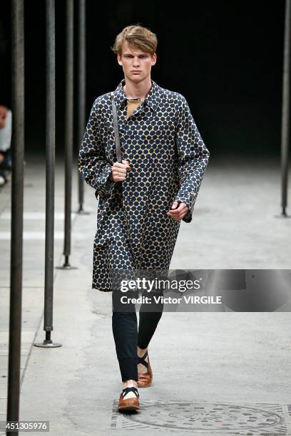 Model walks the runway during the Dries Van Noten show as part of Paris Fashion Week Menswear Spring/Summer 2015 on June 26, 2014 in Paris, France.