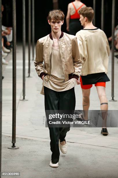 Model walks the runway during the Dries Van Noten show as part of Paris Fashion Week Menswear Spring/Summer 2015 on June 26, 2014 in Paris, France.