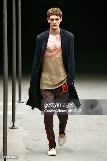 Model walks the runway during the Dries Van Noten show as part of Paris Fashion Week Menswear Spring/Summer 2015 on June 26, 2014 in Paris, France.