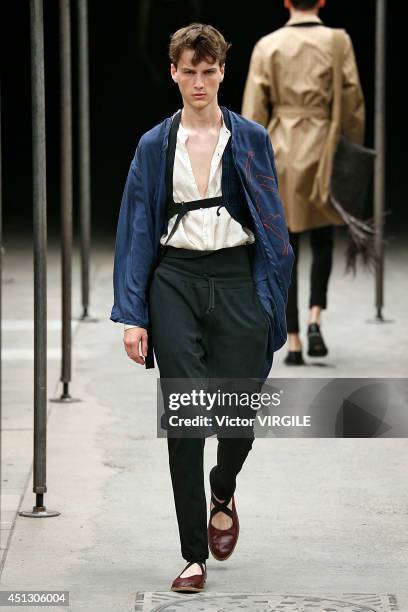 Model walks the runway during the Dries Van Noten show as part of Paris Fashion Week Menswear Spring/Summer 2015 on June 26, 2014 in Paris, France.