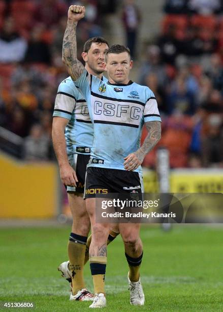 Todd Carney of the Sharks celebrates victory after the round 16 NRL match between the Brisbane Broncos and the Cronulla Sharks at Suncorp Stadium on...