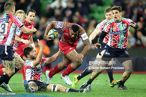 Samu Kerevi of the Reds is tackled during the round 17 Super Rugby match between the Rebels and the Reds at AAMI Park on June 27, 2014 in Melbourne,...