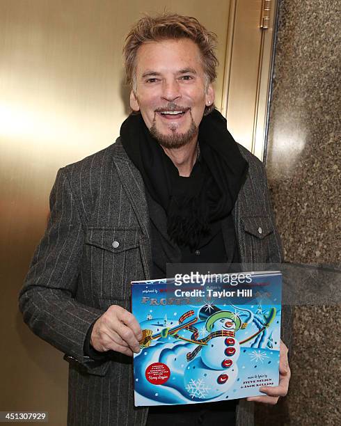 Musician Kenny Loggins promotes his book "Frosty the Snowman" at a private shoot in Rockefeller Center on November 21, 2013 in New York City.