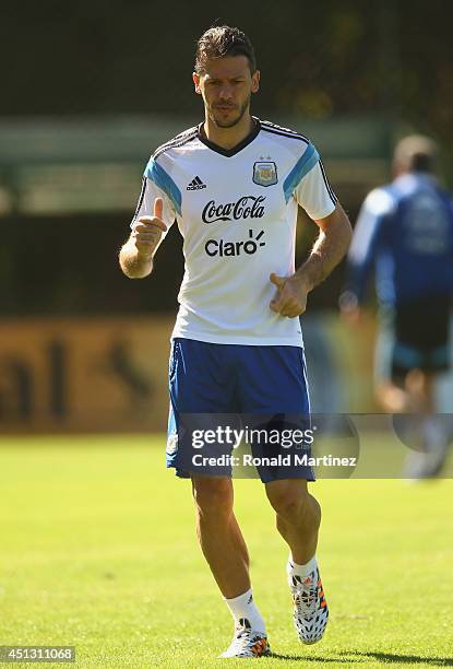 Martin Demichelis of Argentina run during a training session at Cidade do Galo on June 27, 2014 in Vespasiano, Brazil.