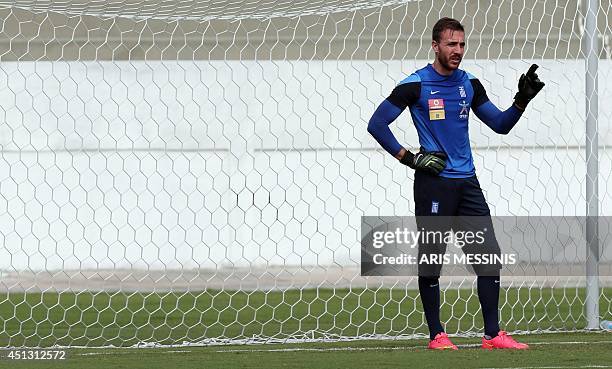 Greece's goalkeeper Panagiotis Glykos attends a training session in Aracaju, Brazil on June 27 two days before the 2014 FIFA World Cup round of 16...