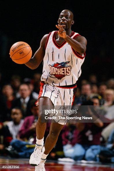 Rodrick Rhodes of the Houston Rockets brings the ball upcourt during ...