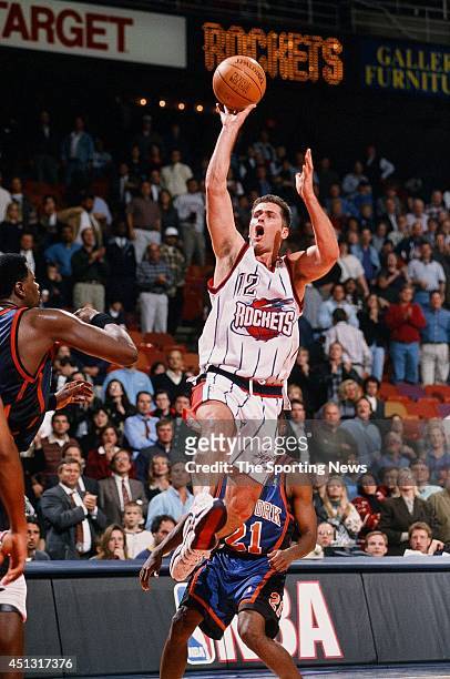 Matt Maloney of the Houston Rockets goes up with the ball during the game against the New York Knicks on November 18, 1997 at the Compaq Center in...