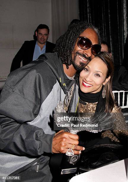Recording artist/honoree Snoop Lion and TV personality Angela Rockwood of Push Girls attend award at Reloading Life - The Art Of Peace Anti Gun...
