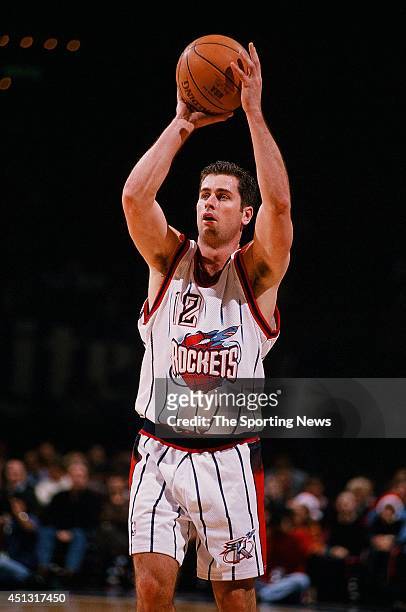 Matt Maloney of the Houston Rockets shoots during the game against the Sacramento Kings on December 19, 1997 at the Compaq Center in Houston, Texas....