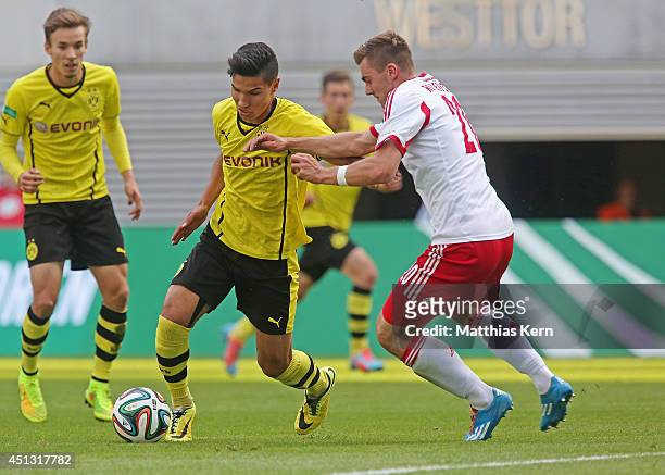 Hayrullah Alici of Dortmund battles for the ball with Johann Reichel of Leipzig during the B Juniors Bundesliga final match between RB Leipzig and...