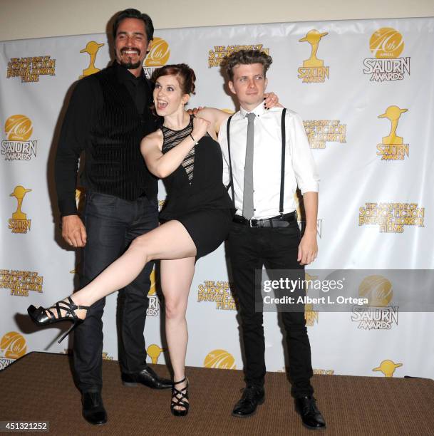 Actors Victor Webster, Magda Apanowicz and Erik Knudsen pose inside the press room of the 40th Annual Saturn Awards held at The Castaway on June 26,...