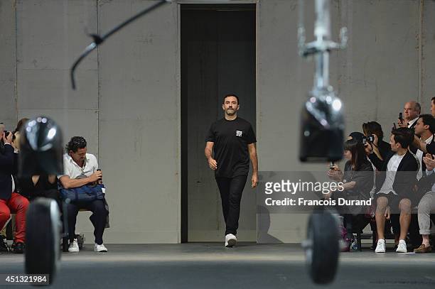Fashion designer Riccardo Tisci acknowledges the applause of the audience after the Givenchy show as part of the Paris Fashion Week Menswear...