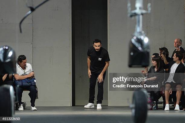 Fashion designer Riccardo Tisci acknowledges the applause of the audience after the Givenchy show as part of the Paris Fashion Week Menswear...