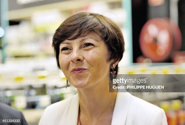 French Trade and Handicraft Junior Minister Carole Delga smiles as she visits a trade center on June 27 in Faches-Thumesnil, northern France. AFP...
