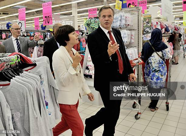 French Trade and Handicraft Junior Minister Carole Delga speaks with Francois Poupard, general director of Auchan store in Faches-Thumesnil, a branch...